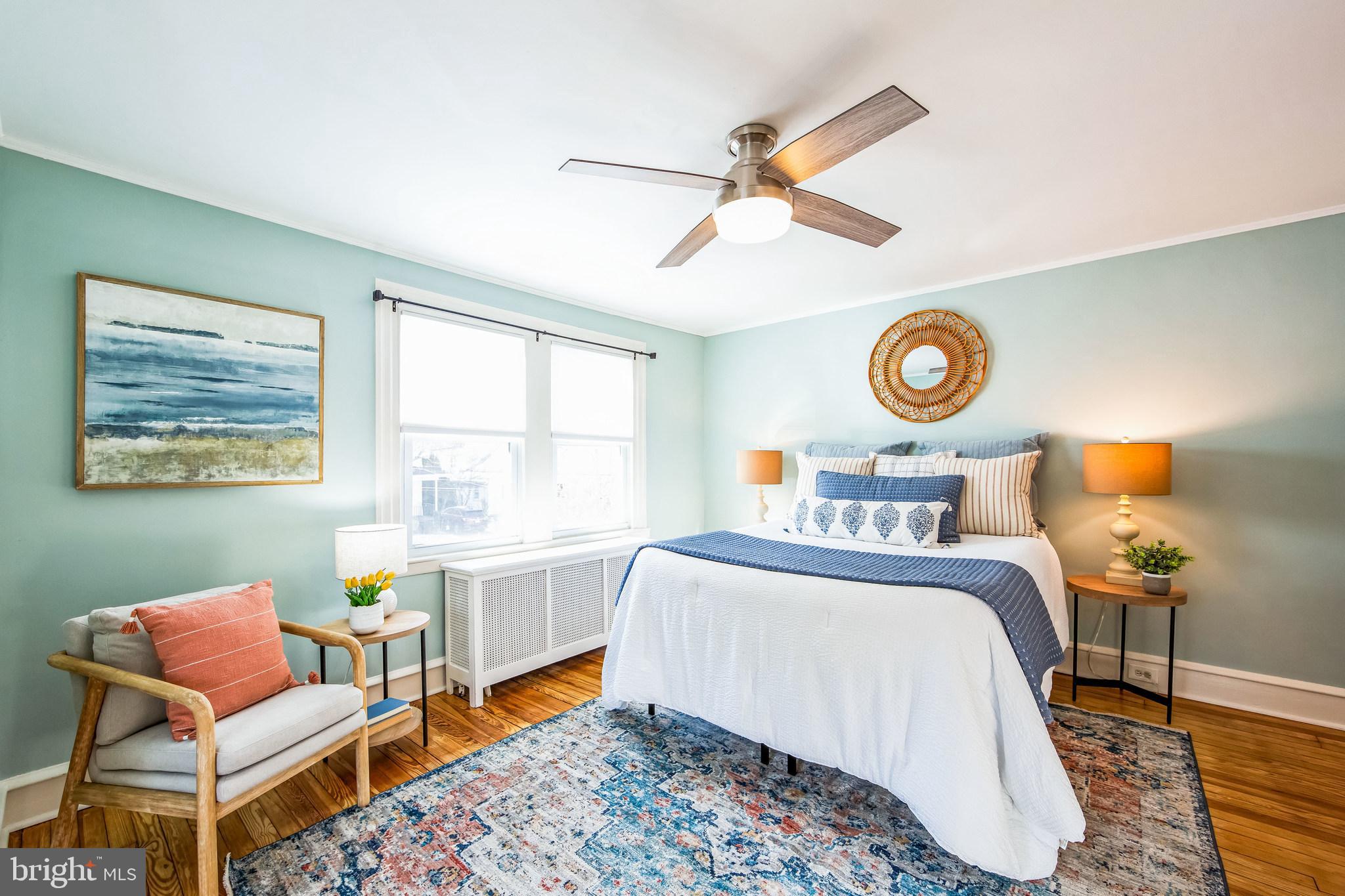 2423 Avon Road Ardmore, PA 19003 - Photo 22 of 37 a bedroom with a bed and a chandelier