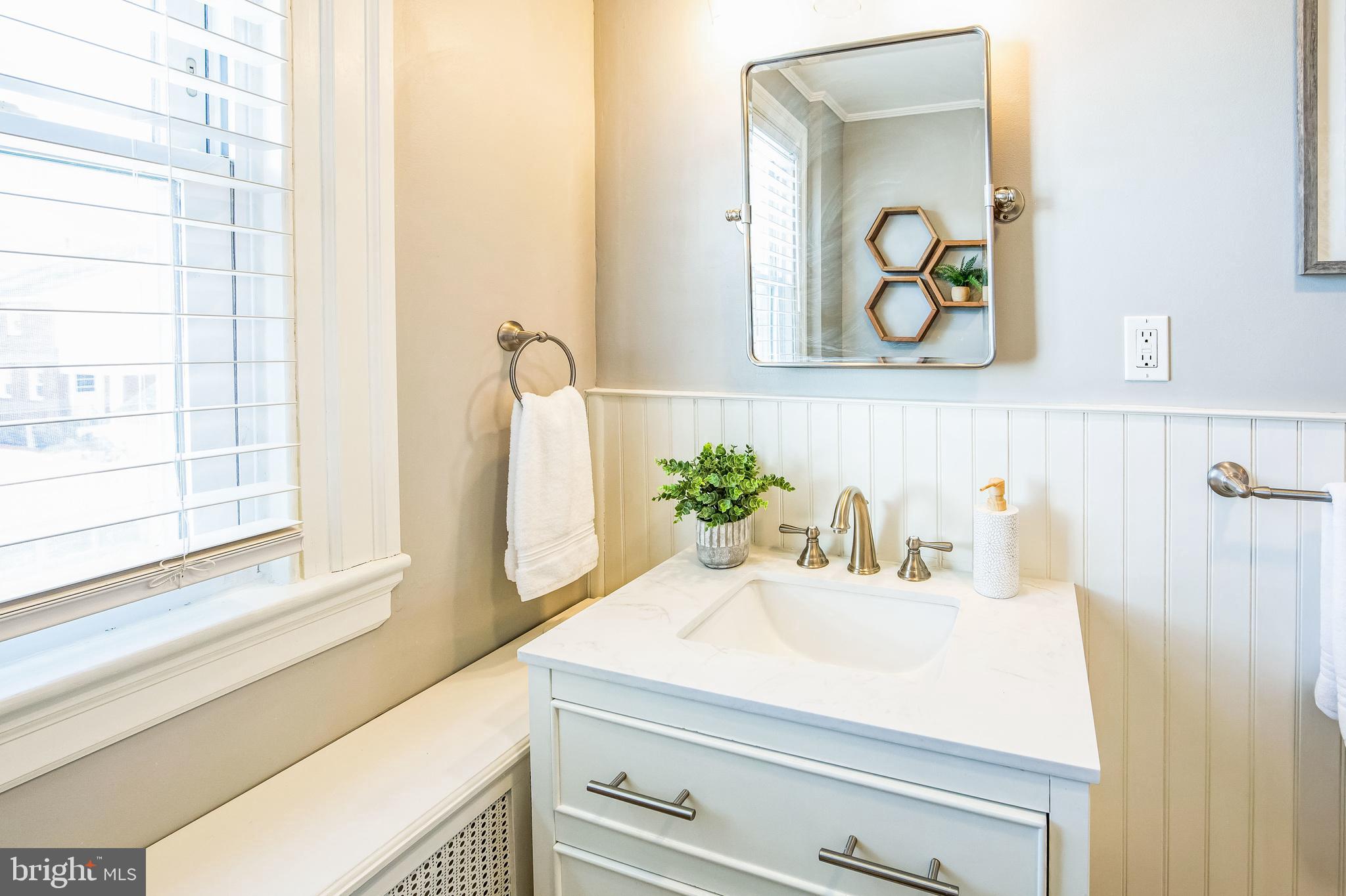 2423 Avon Road Ardmore, PA 19003 - Photo 29 of 37 a bathroom with a sink and a mirror