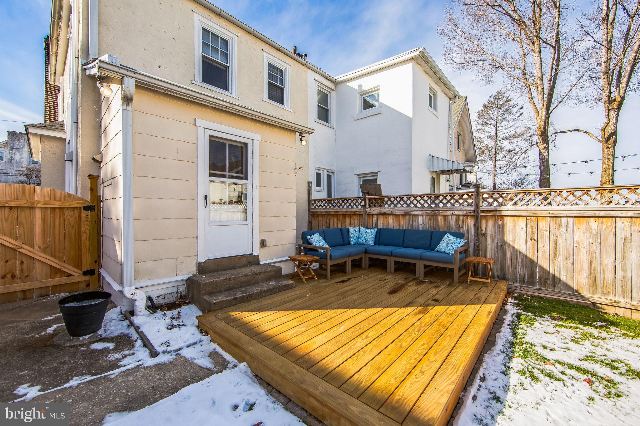 2423 Avon Road Ardmore, PA 19003 - Photo 36 of 37 a view of a house with wooden deck and furniture