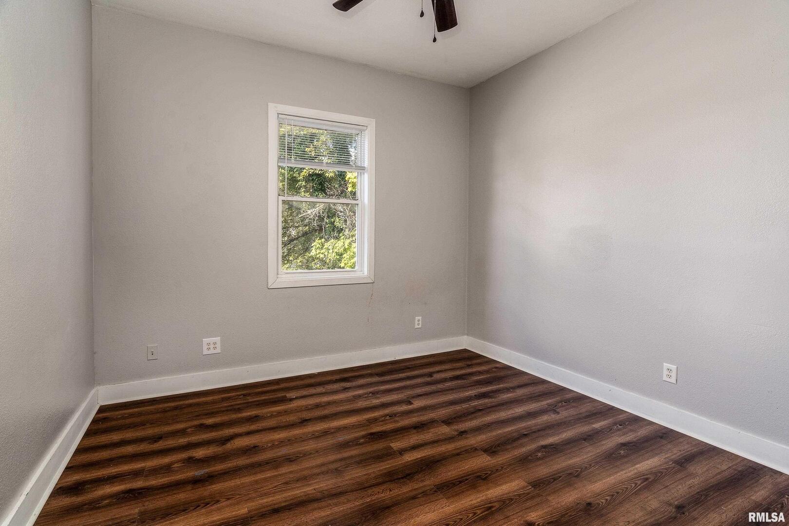 609 South Poplar Street Carbondale, IL 62901 - Photo 29 of 44 a view of room with window and hardwood floor