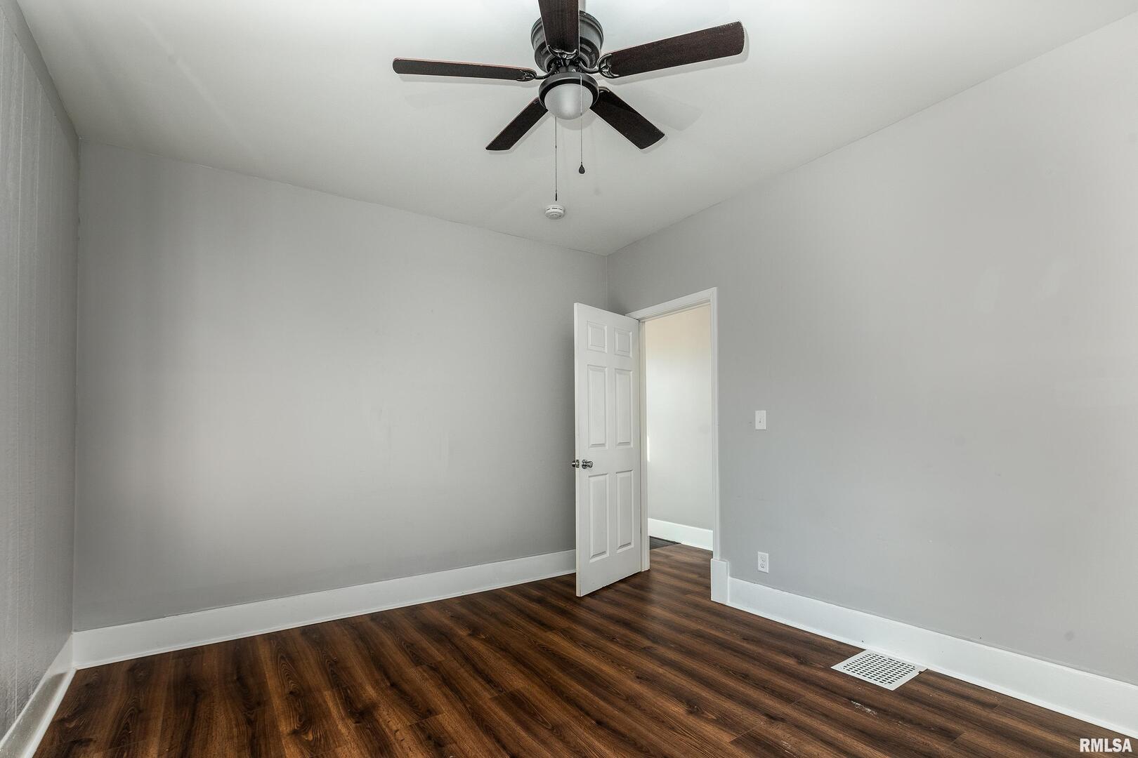609 South Poplar Street Carbondale, IL 62901 - Photo 34 of 44 wooden floor in an empty room