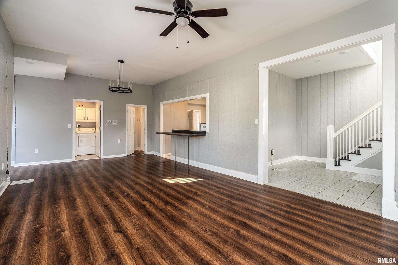 609 South Poplar Street Carbondale, IL 62901 - Photo 8 of 44 a view of empty room with wooden floor and fan