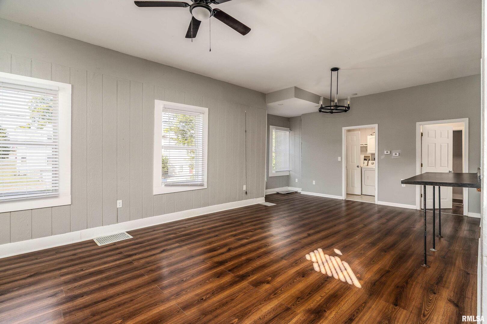 609 South Poplar Street Carbondale, IL 62901 - Photo 9 of 44 a view of an empty room with window and wooden floor
