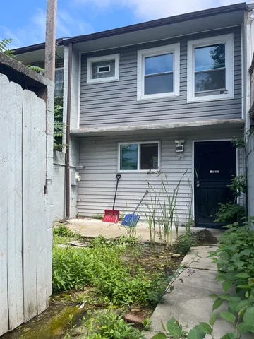 a view of a pathway with a wrought fence