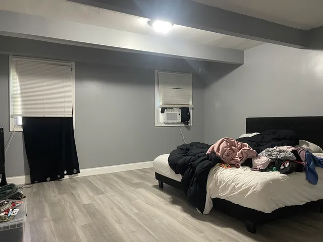 a bedroom with a bed and a television
