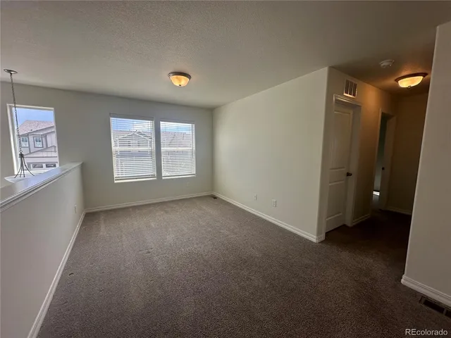 a bathroom with a shower and a glass door