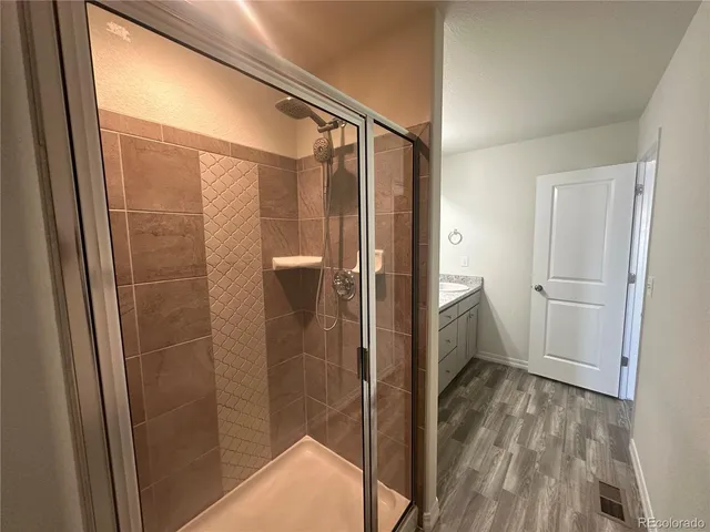 a bathroom with a shower and toilet