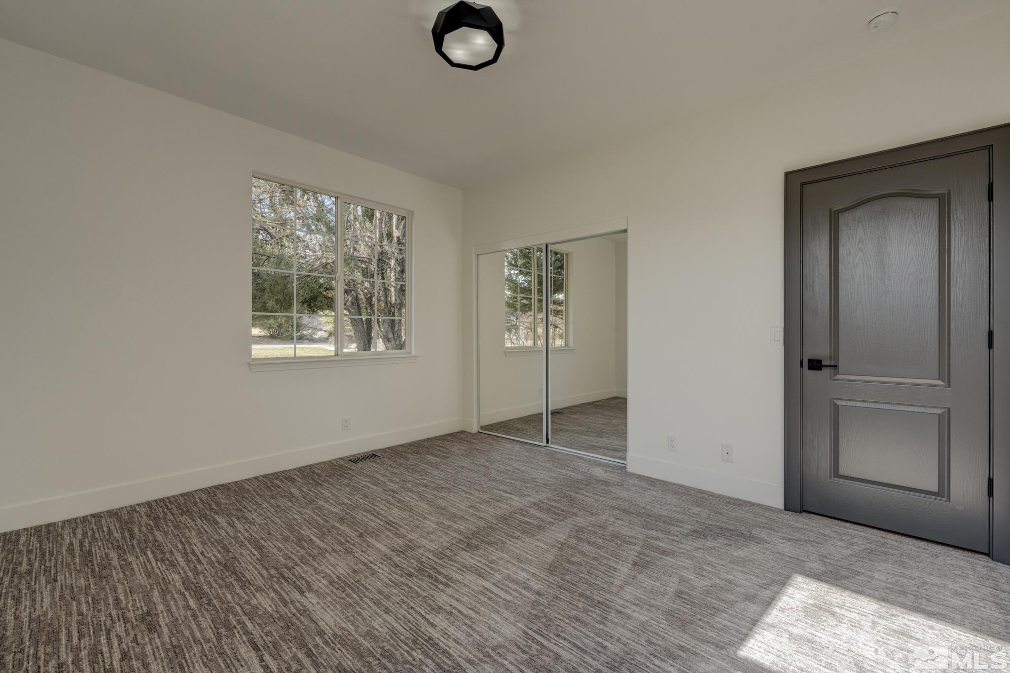 1095 Flanders Road Reno, NV 89511 - Photo 26 of 39 an empty room with windows and closet