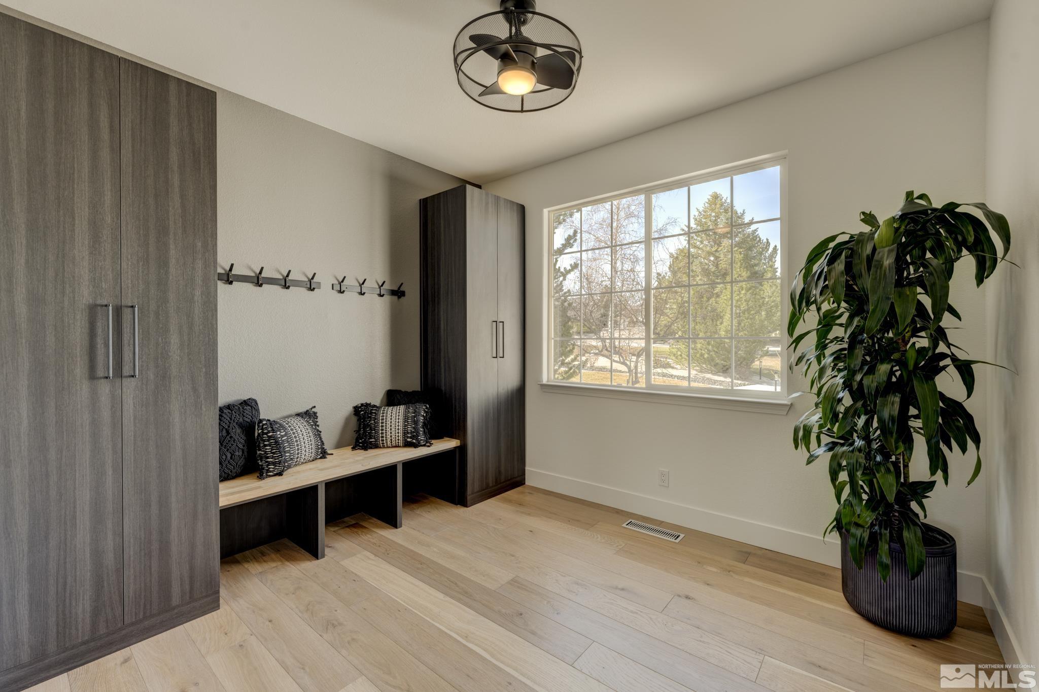 1095 Flanders Road Reno, NV 89511 - Photo 30 of 39 a living room with furniture and a potted plant