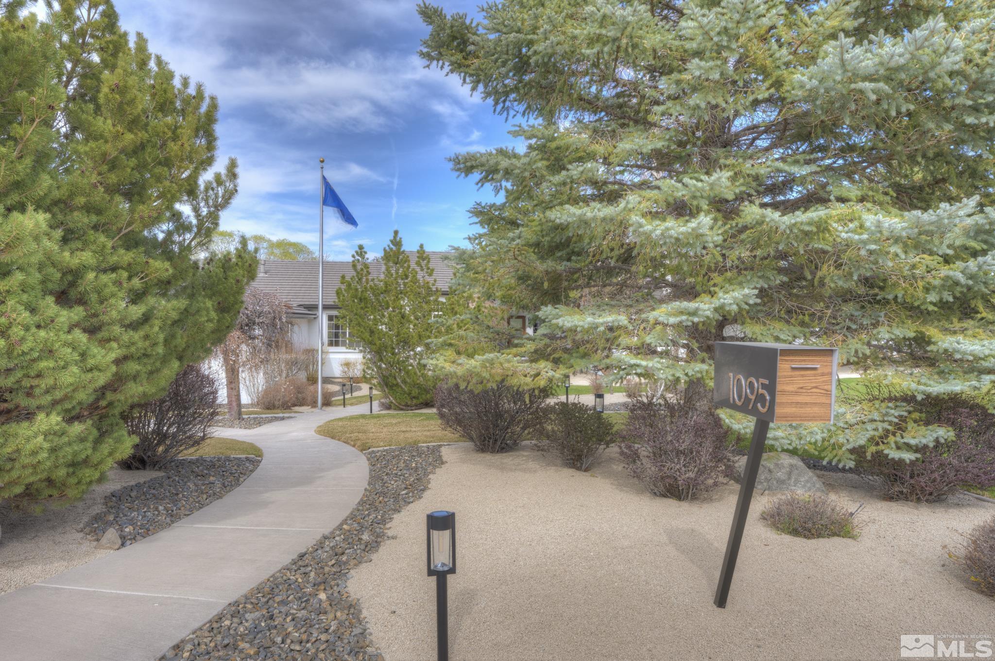1095 Flanders Road Reno, NV 89511 - Photo 3 of 39 a view of a street with some trees