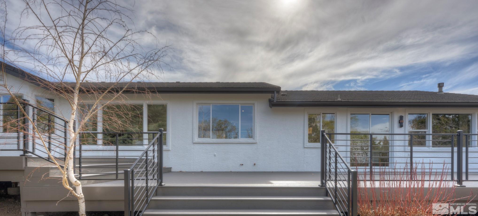1095 Flanders Road Reno, NV 89511 - Photo 33 of 39 a view of a house with wooden fence and windows