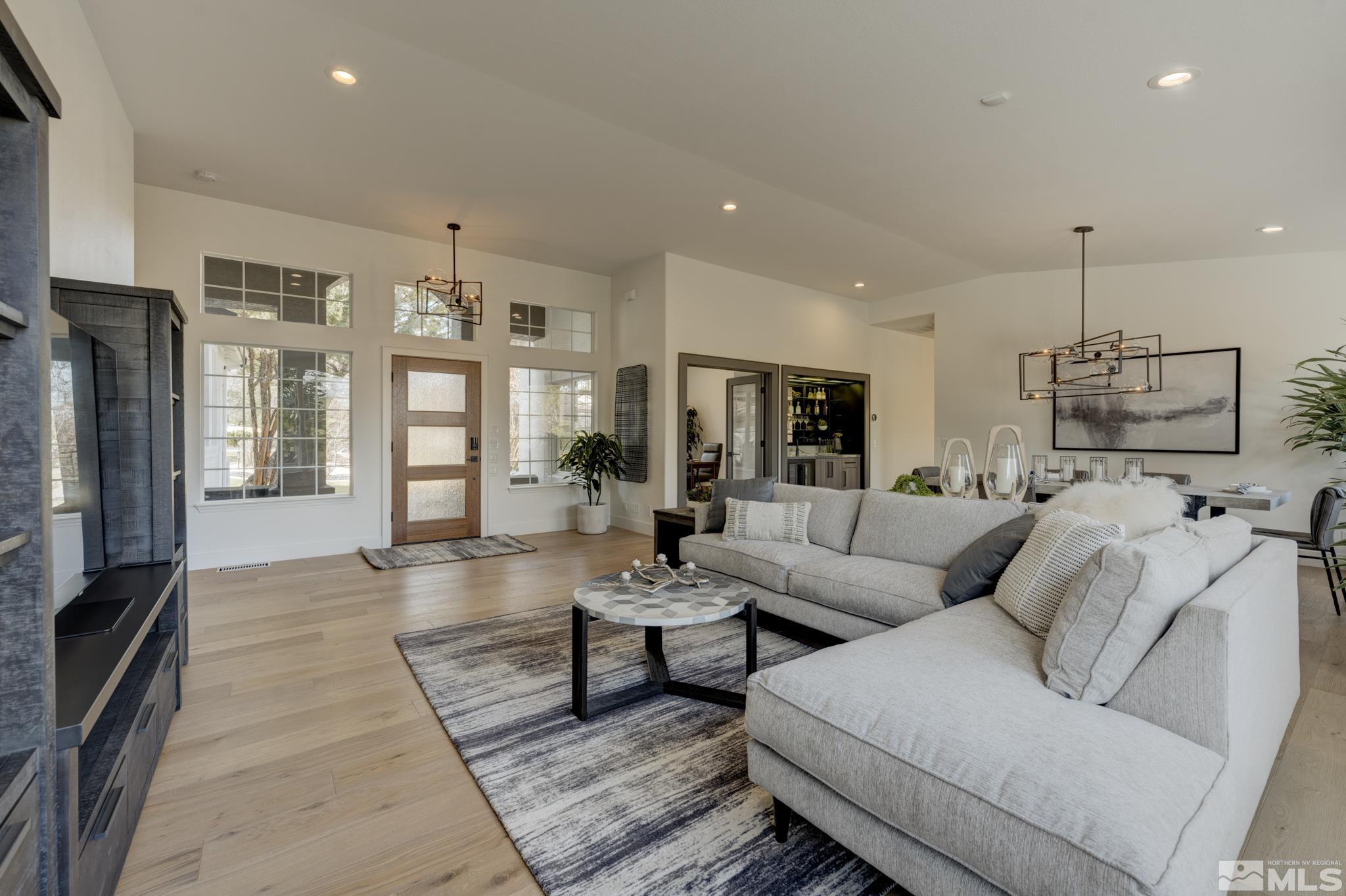 1095 Flanders Road Reno, NV 89511 - Photo 5 of 39 a living room with furniture and a flat screen tv