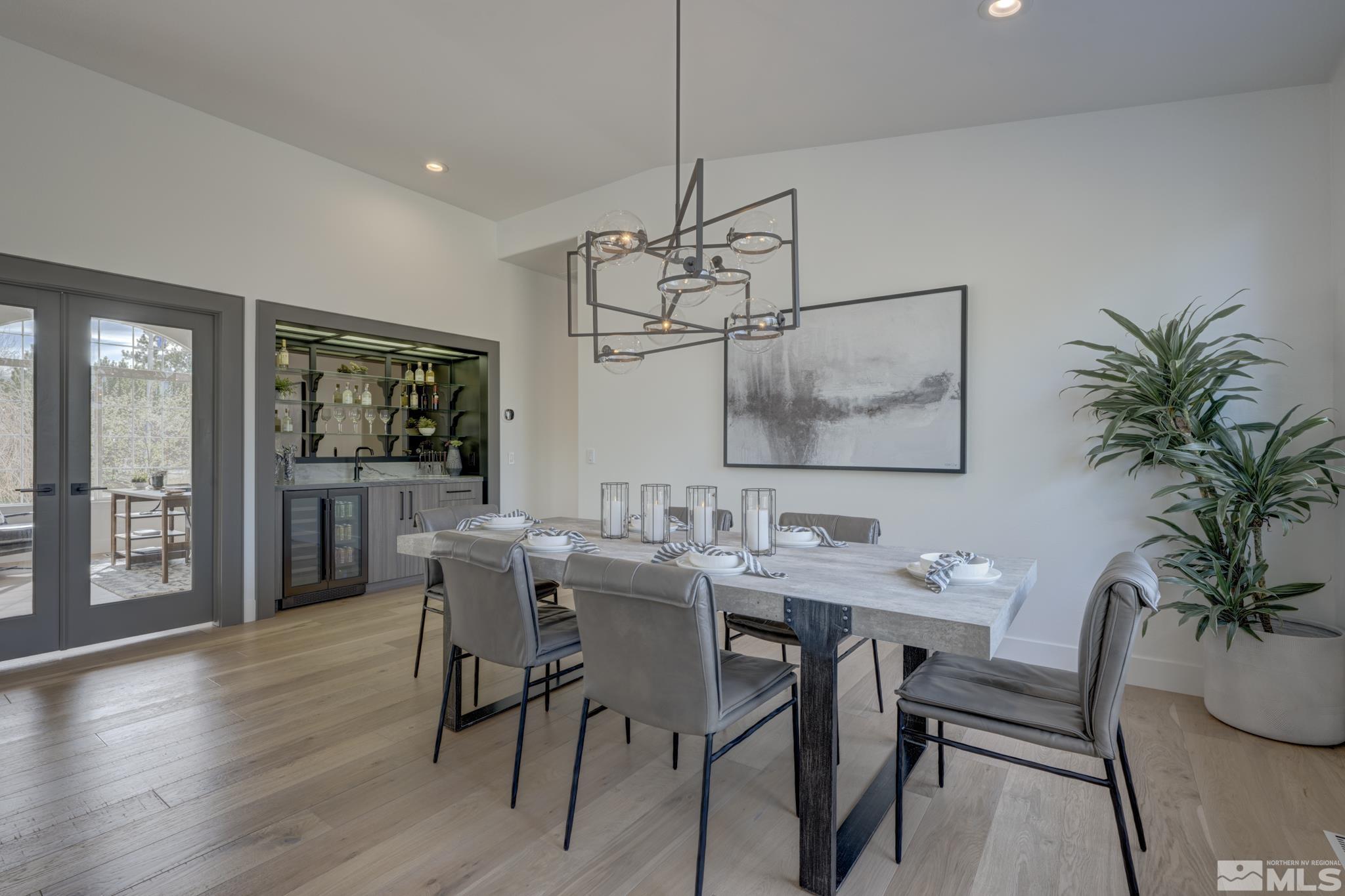 1095 Flanders Road Reno, NV 89511 - Photo 6 of 39 a view of a dining room with furniture window and wooden floor