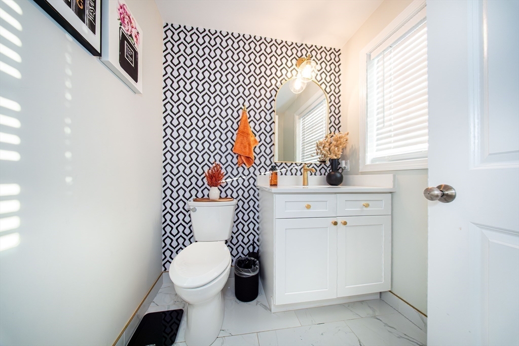 27 Vista Way Fall River, MA 02724 - Photo 22 of 33 a bathroom with a toilet sink and mirror