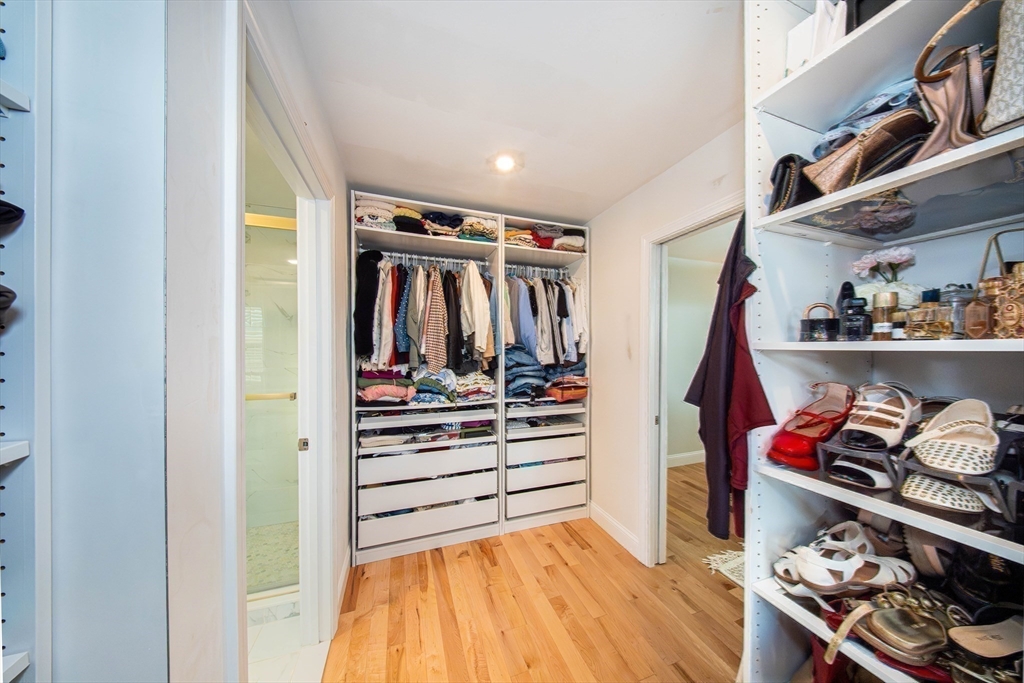 27 Vista Way Fall River, MA 02724 - Photo 25 of 33 a view of walk in closet with clothes and shoes