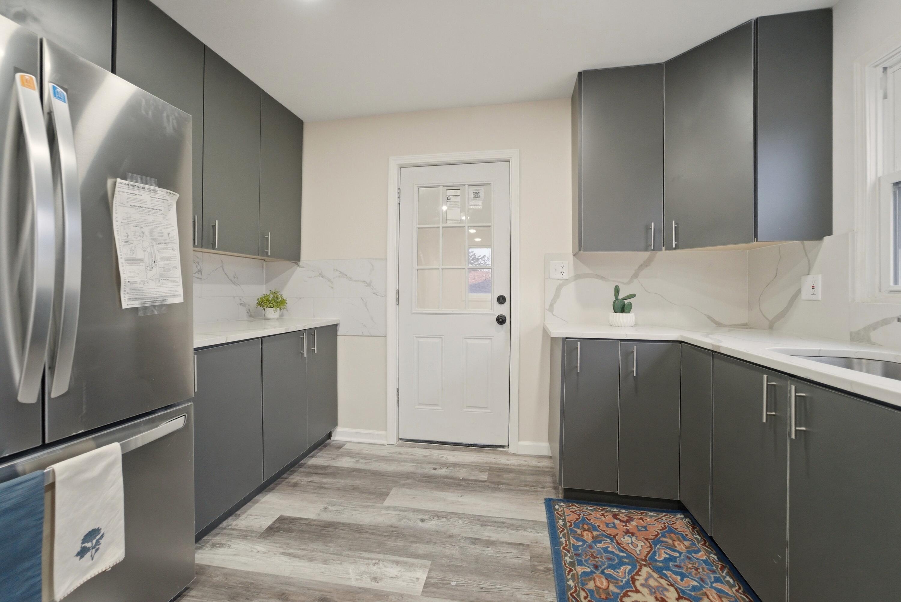 747 North Lafayette Street Griffith, IN 46319 - Photo 11 of 31 a kitchen with a sink and a refrigerator