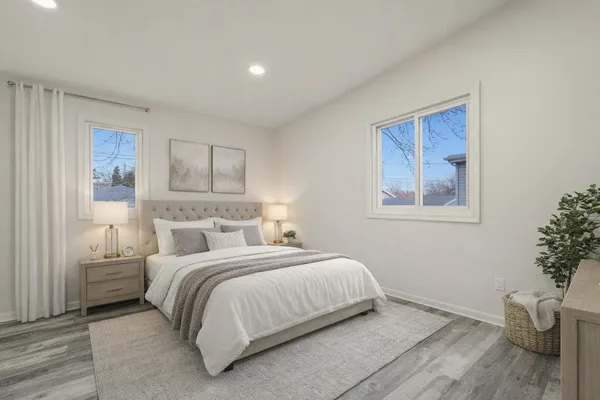 a bedroom with a bed and a view of bathroom