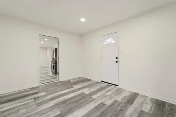 a bathroom with a sink a mirror a toilet and bathtub