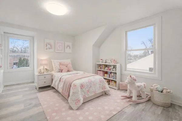 a bedroom with a bed and a walk in closet