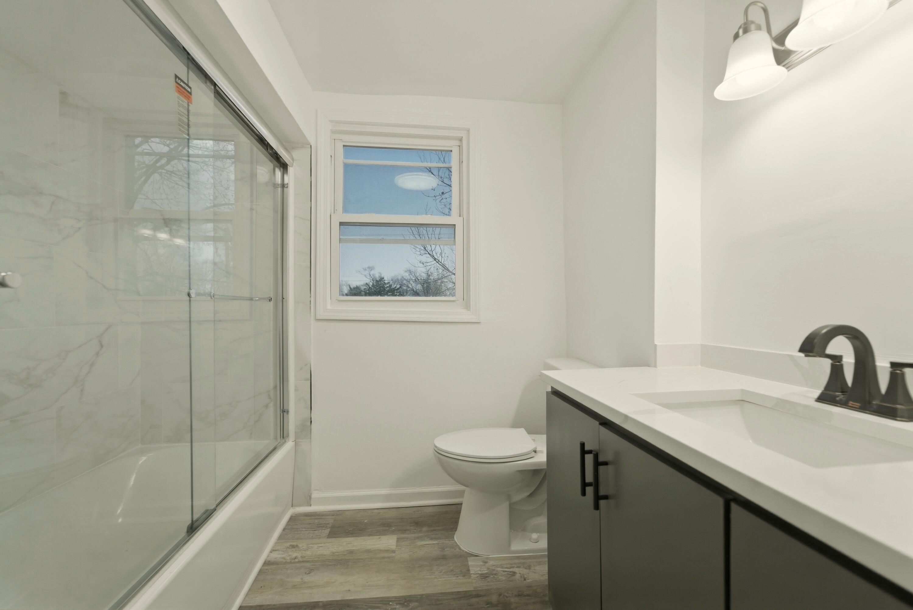 747 North Lafayette Street Griffith, IN 46319 - Photo 19 of 31 a bathroom with a sink toilet and shower