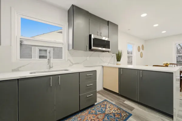 a kitchen with a sink and a refrigerator