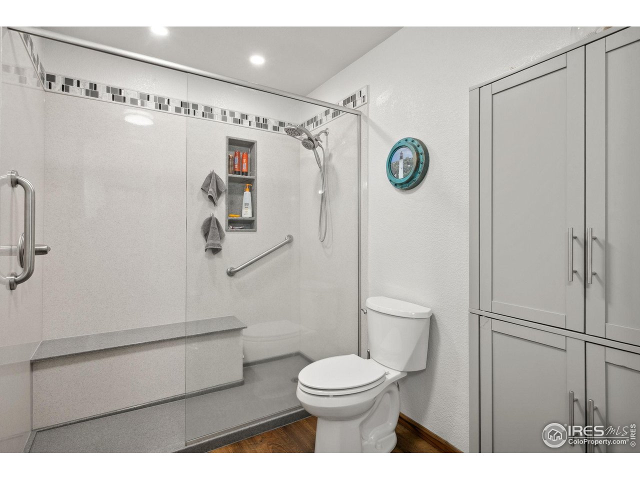 2131 68th Avenue Greeley, CO 80634 - Photo 12 of 39 a bathroom with a toilet and a shower
