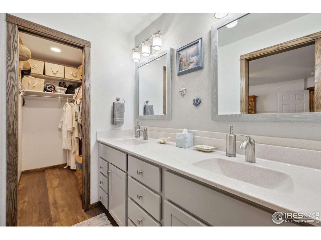 2131 68th Avenue Greeley, CO 80634 - Photo 13 of 39 a bathroom with a sink double vanity granite and a mirror