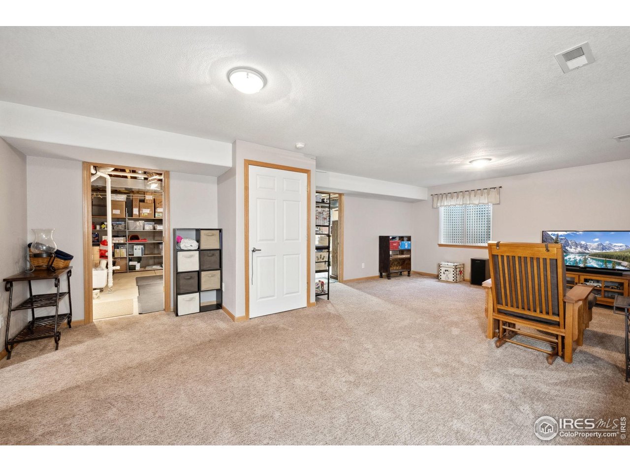 2131 68th Avenue Greeley, CO 80634 - Photo 21 of 39 a view of a livingroom with furniture and closet