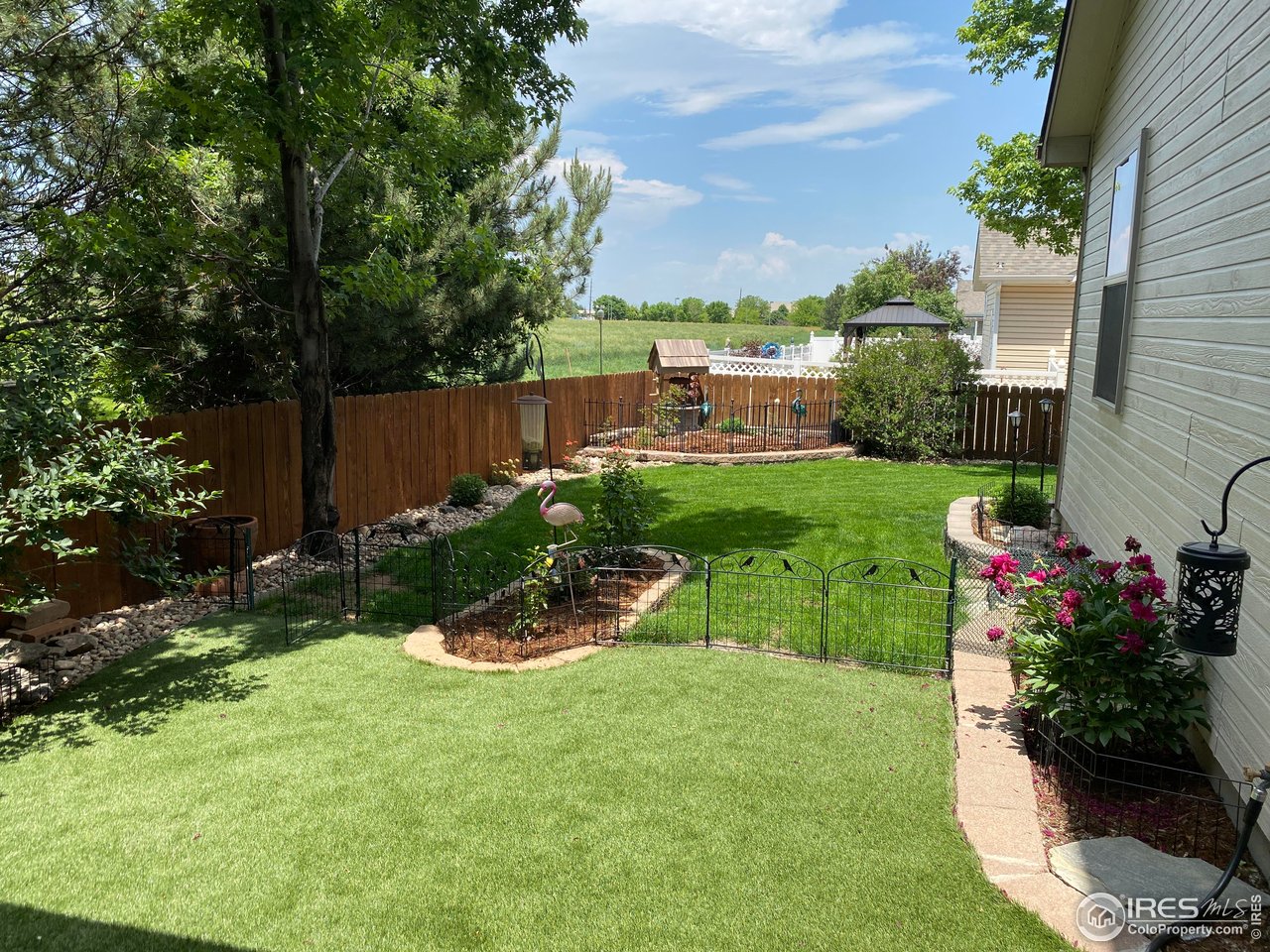 2131 68th Avenue Greeley, CO 80634 - Photo 25 of 39 a view of a chair and table in the garden