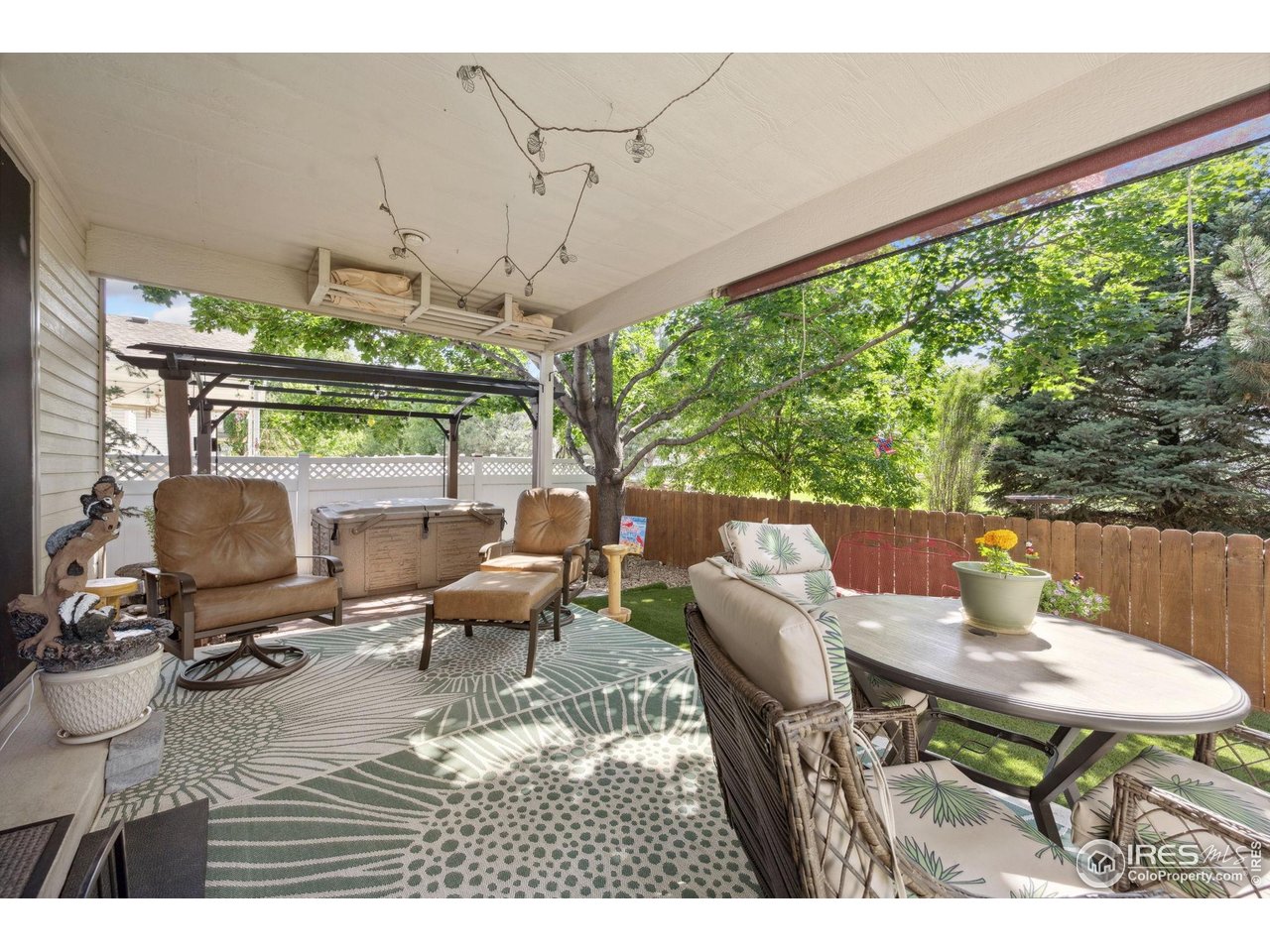 2131 68th Avenue Greeley, CO 80634 - Photo 27 of 39 a view of a patio with a dining table and chairs