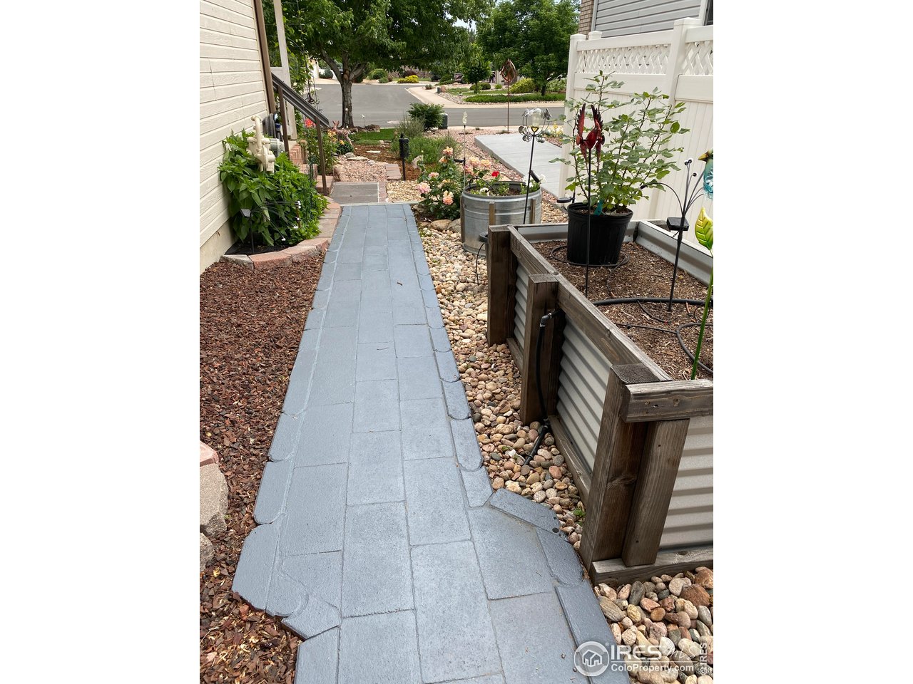 2131 68th Avenue Greeley, CO 80634 - Photo 30 of 39 a balcony with outdoor seating and plants