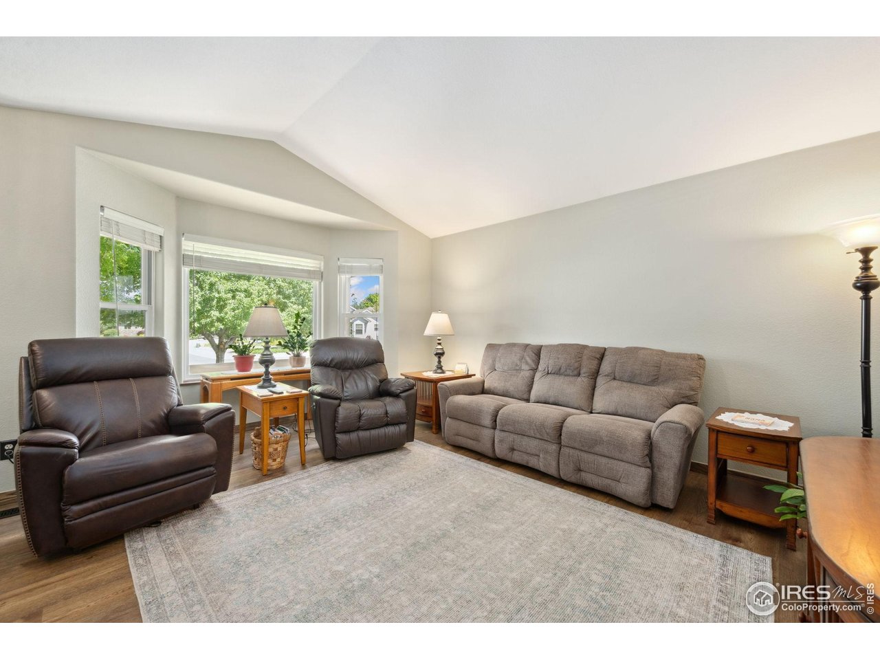 2131 68th Avenue Greeley, CO 80634 - Photo 3 of 39 a living room with furniture and a large window