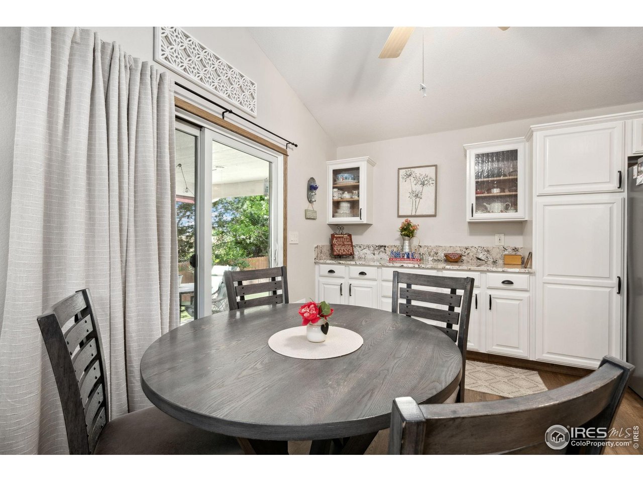 2131 68th Avenue Greeley, CO 80634 - Photo 9 of 39 a living room with furniture and a table