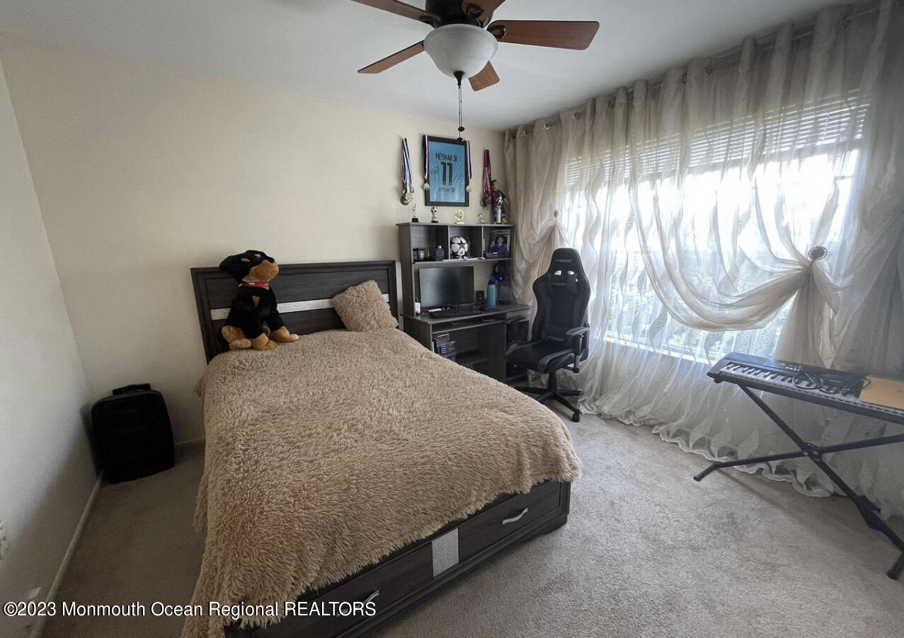 16 William Drive Howell, NJ 07731 - Photo 14 of 25 a bedroom with a bed and dresser with mirror