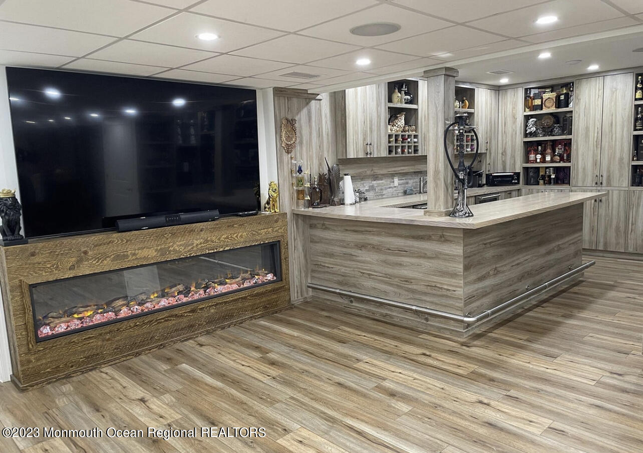 16 William Drive Howell, NJ 07731 - Photo 19 of 25 a view of living room with granite countertop furniture and fireplace