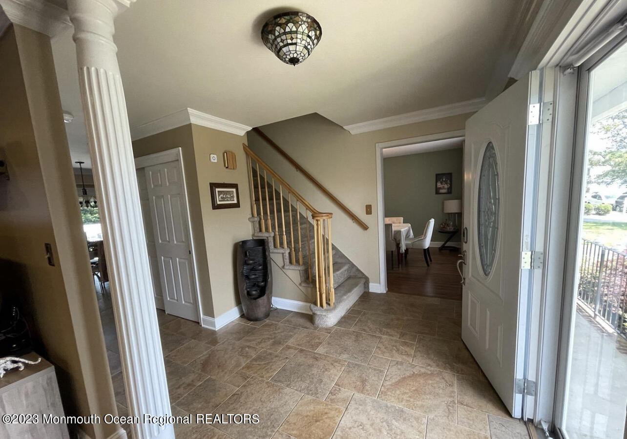 16 William Drive Howell, NJ 07731 - Photo 2 of 25 a view of a hallway with staircase