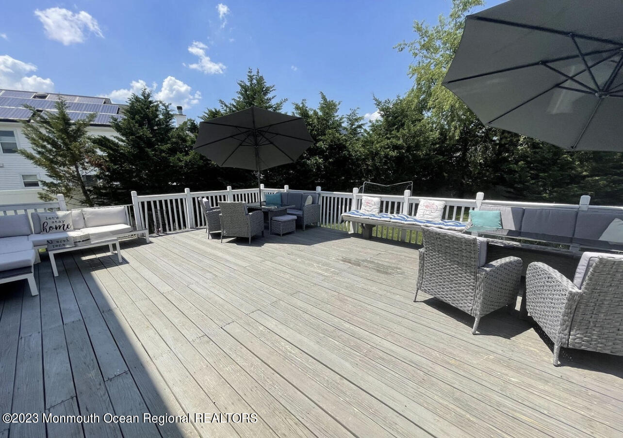 16 William Drive Howell, NJ 07731 - Photo 24 of 25 a view of balcony with seating space and trees