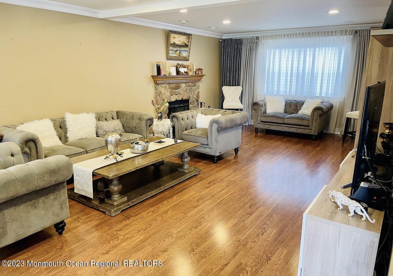 16 William Drive Howell, NJ 07731 - Photo 3 of 25 a living room with furniture and a flat screen tv