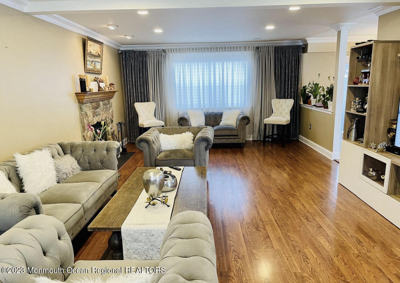 16 William Drive Howell, NJ 07731 - Photo 4 of 25 a living room with furniture and a flat screen tv