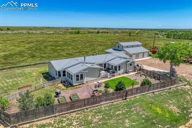 an aerial view of a house with a ocean view