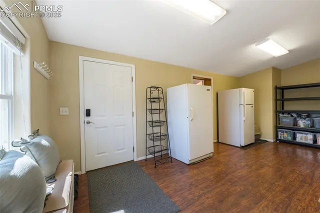 a view of a livingroom with furniture and a window