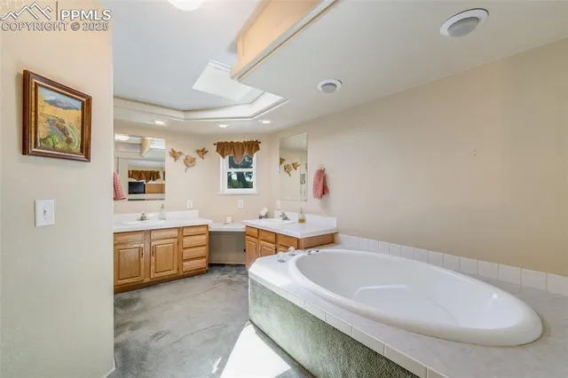 a spacious bathroom with sink mirror and bathtub