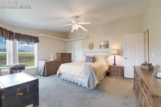 a bedroom with bed and window