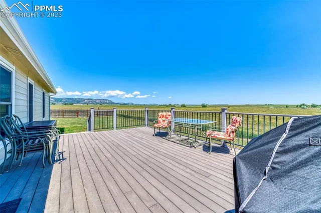 a view of roof deck with patio