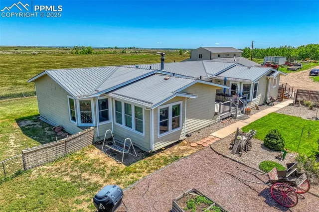 an aerial view of a house with a garden