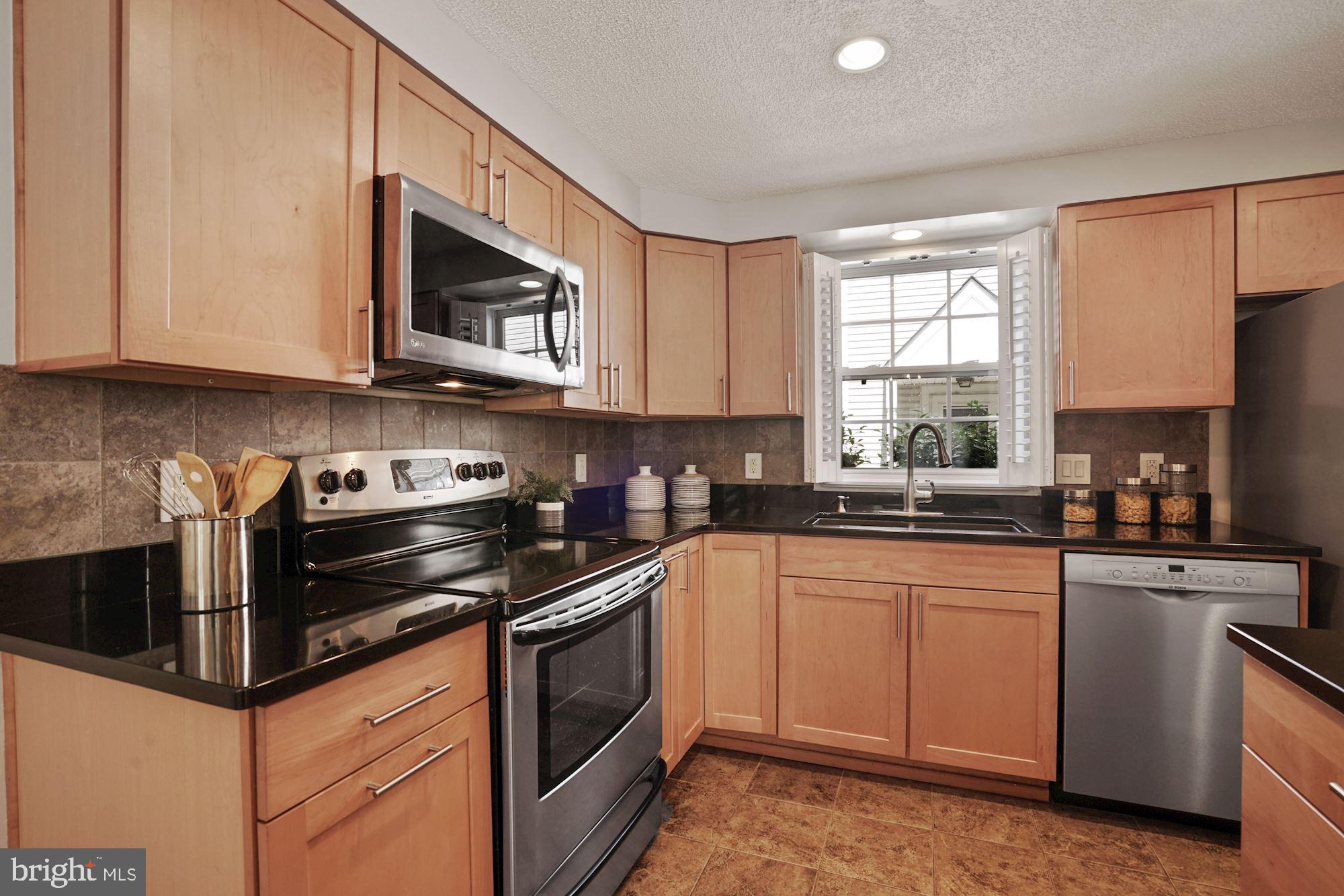 132 East Glebe Road Alexandria, VA 22305 - Photo 8 of 32 Kitchen with stainless steel appliances & granite