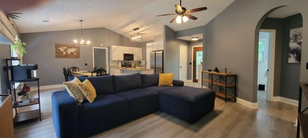 2140 Summerset Drive Monroe, GA 30656 - Photo 6 of 43 a living room with furniture and a chandelier