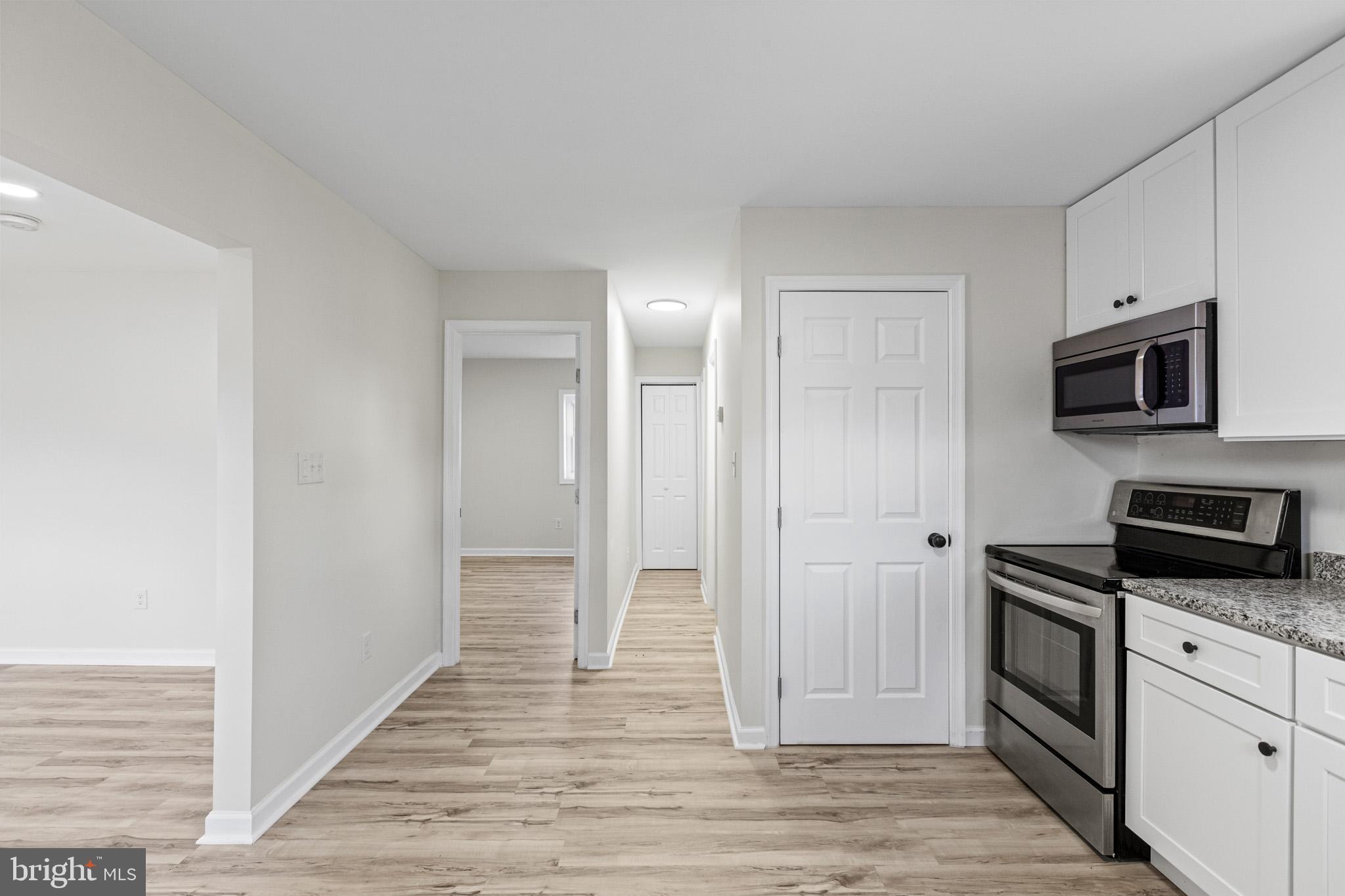 7764 Port Tobacco Road Port Tobacco, MD 20677 - Photo 5 of 14 a view of a kitchen from the hallway