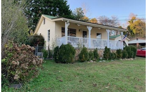 512 Austin Street Blue Ridge, GA 30513 - Photo 1 of 1 a view of a yard in front of house
