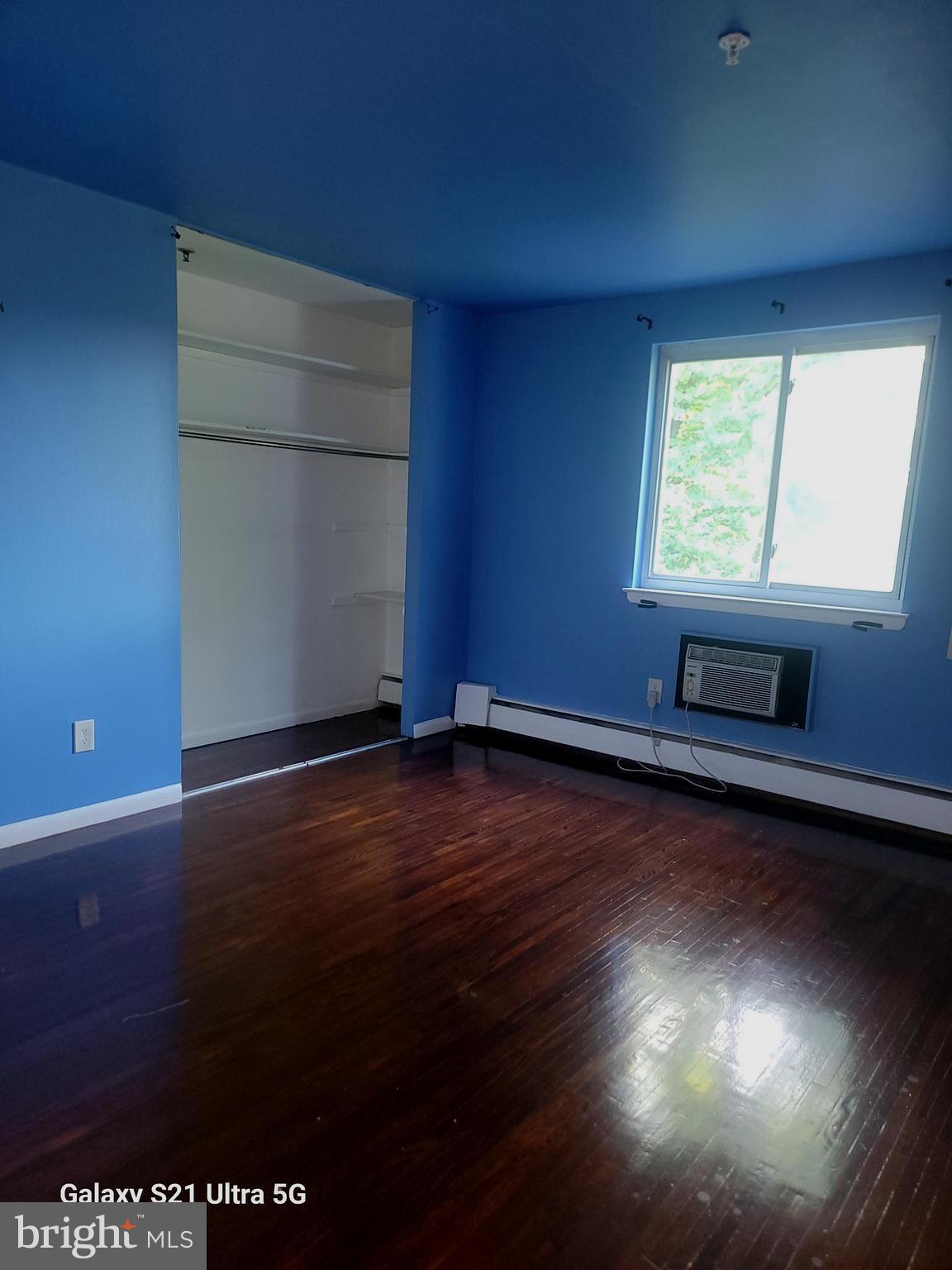 1600 Church Road, Unit C311 Wyncote, PA 19095 - Photo 18 of 26 an empty room with wooden floor and windows
